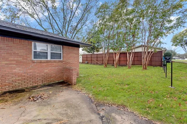 a view of a backyard with a small cabin