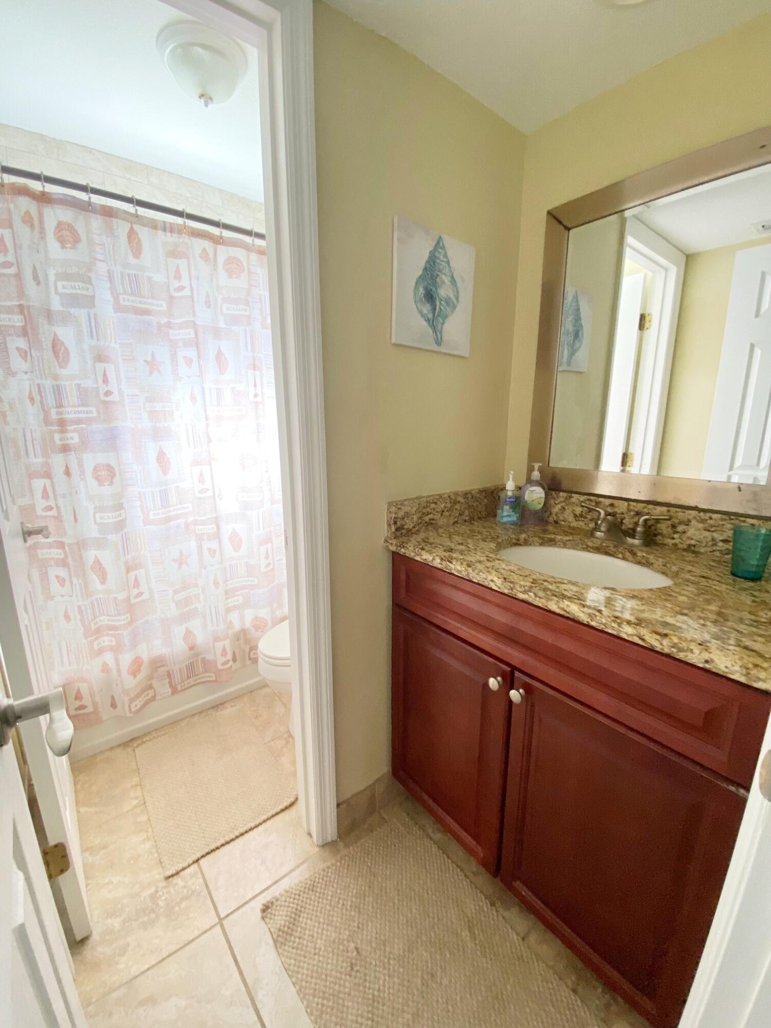 801 Hummingbird Way, Unit 104 North Palm Beach, FL 33408 - Photo 13 of 24 12) Bathroom full I