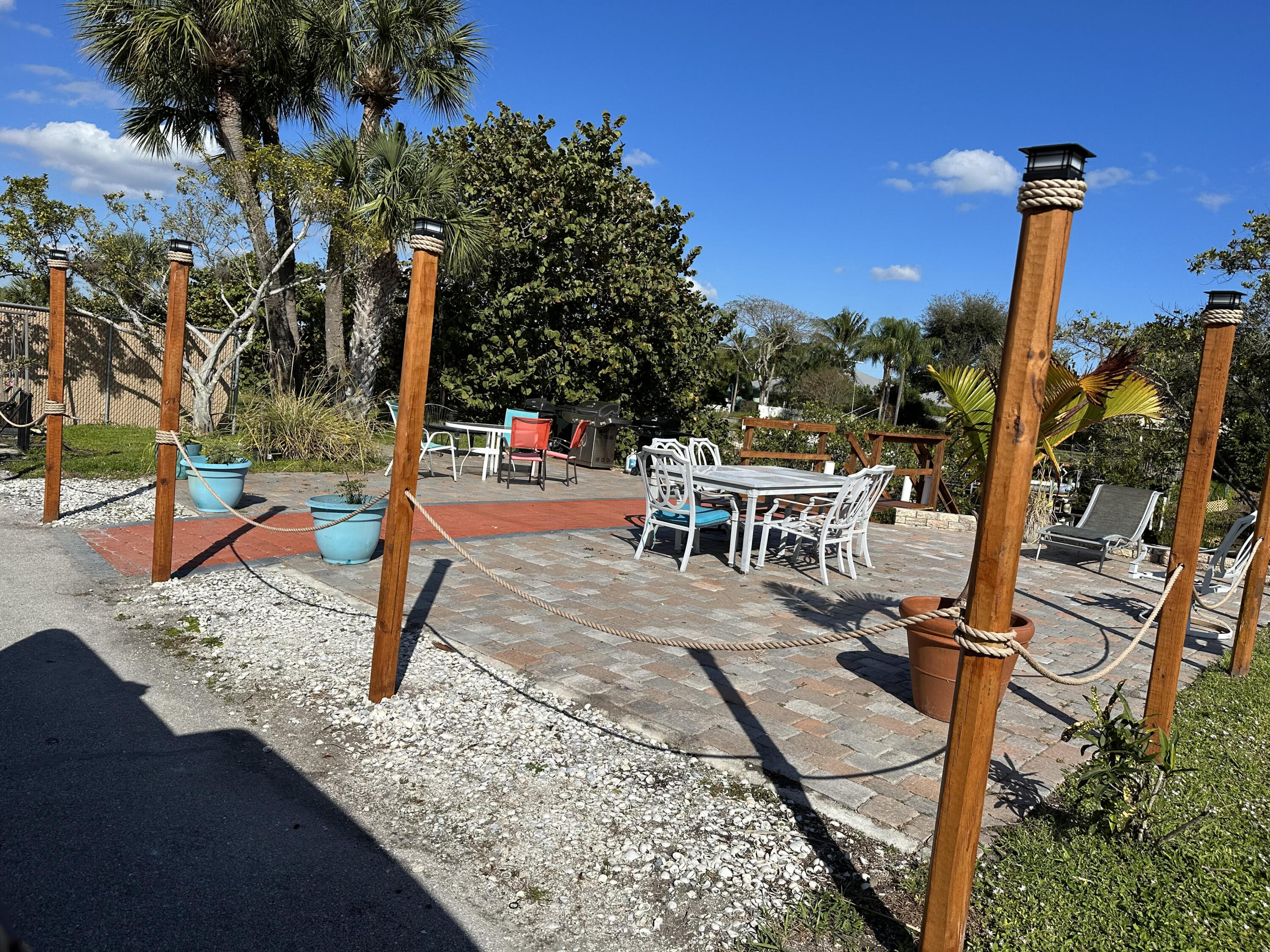 801 Hummingbird Way, Unit 104 North Palm Beach, FL 33408 - Photo 19 of 24 18 - Community patio II
