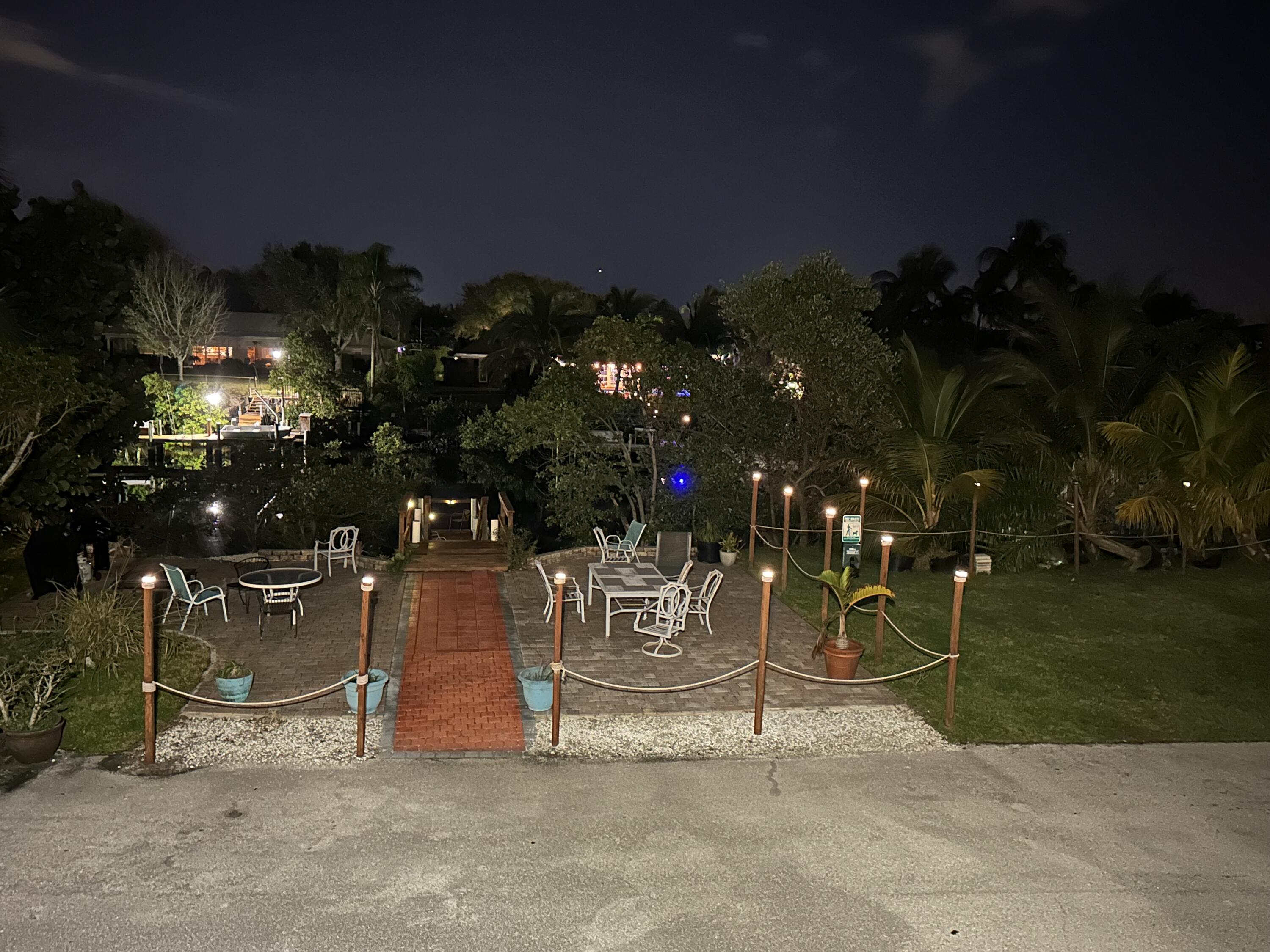 801 Hummingbird Way, Unit 104 North Palm Beach, FL 33408 - Photo 23 of 24 20- Backyard at night I