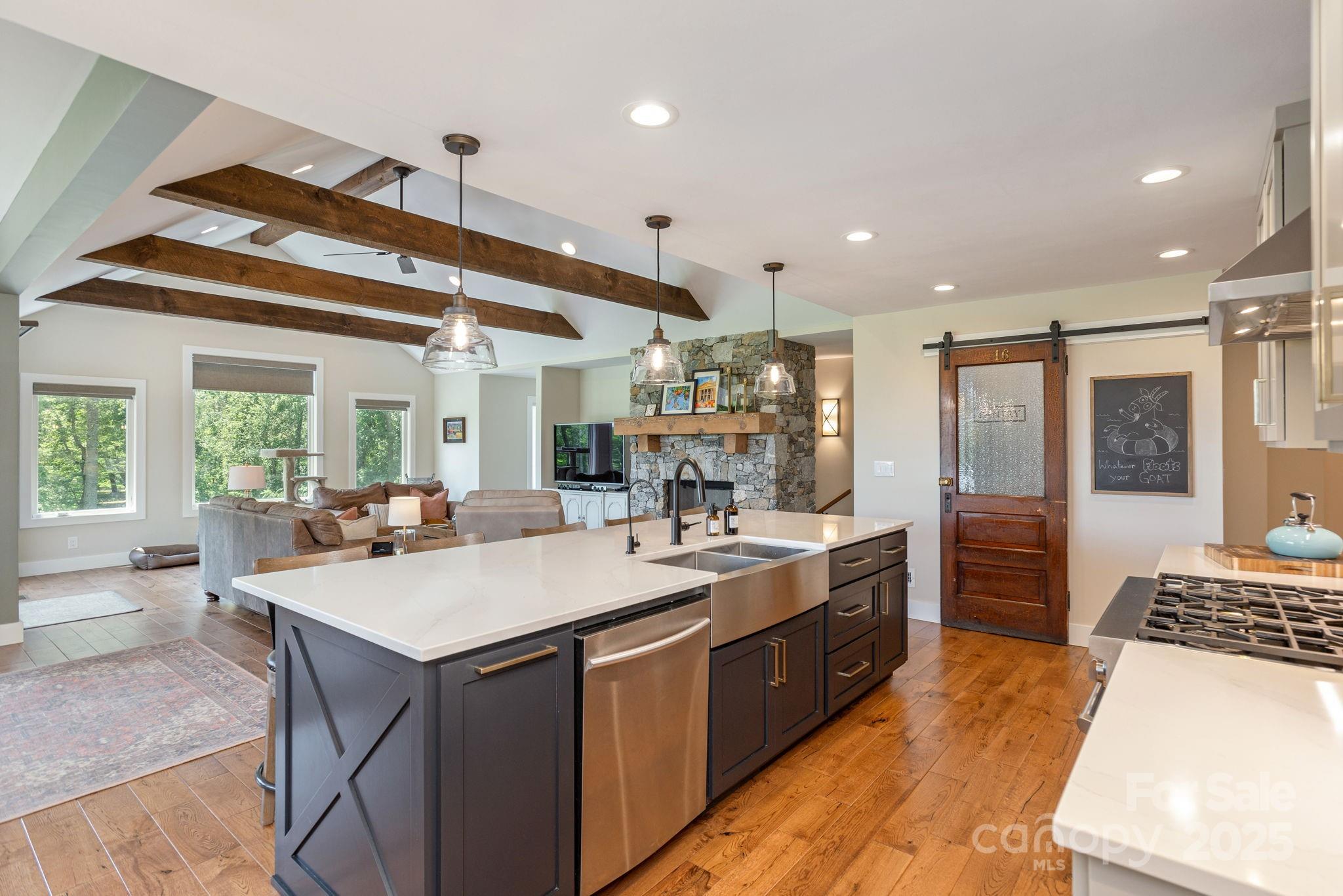 16 School House Road Mills River, NC 28759 - Photo 12 of 48 a kitchen with a stove a sink and a refrigerator