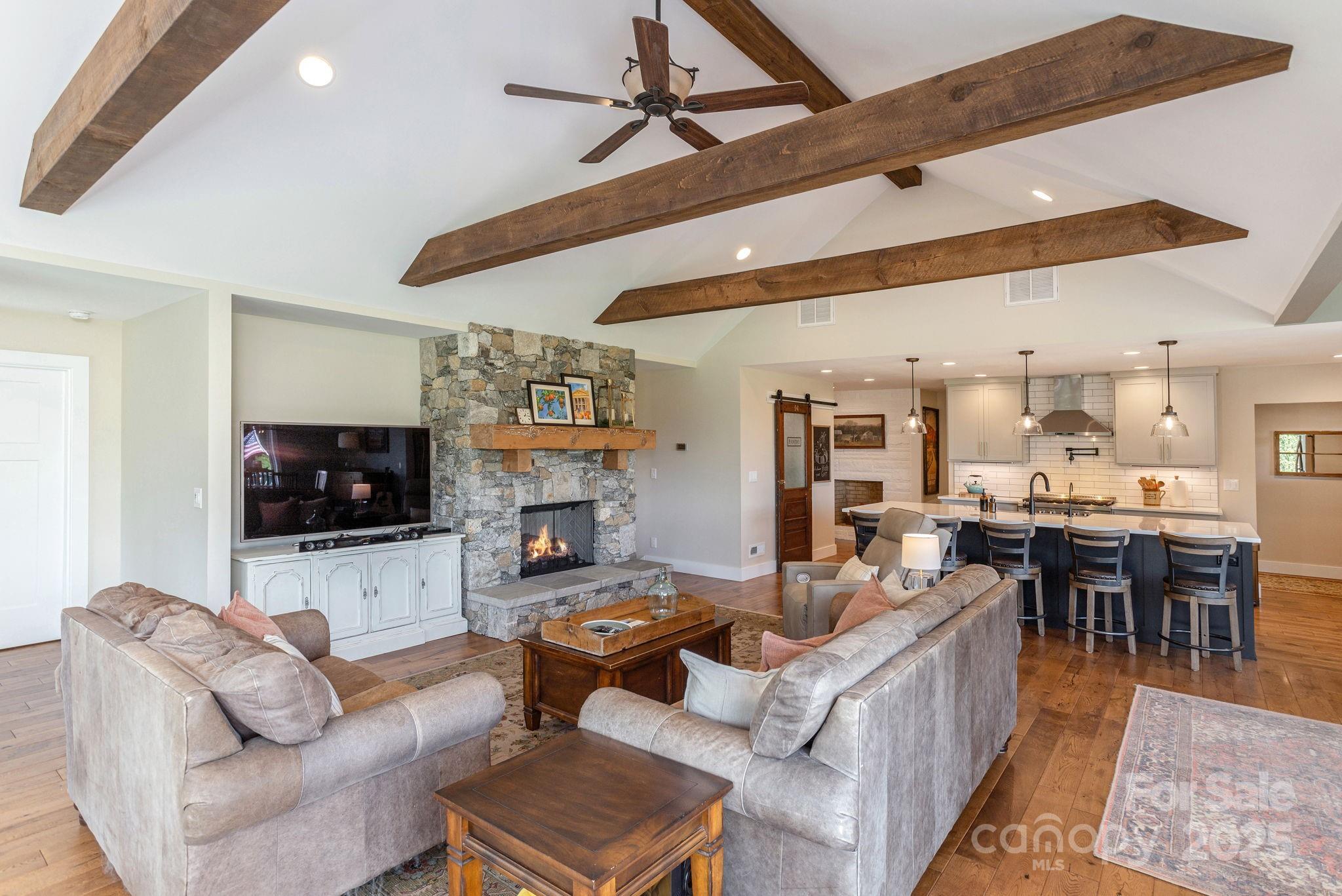 16 School House Road Mills River, NC 28759 - Photo 15 of 48 a living room with furniture and a flat screen tv