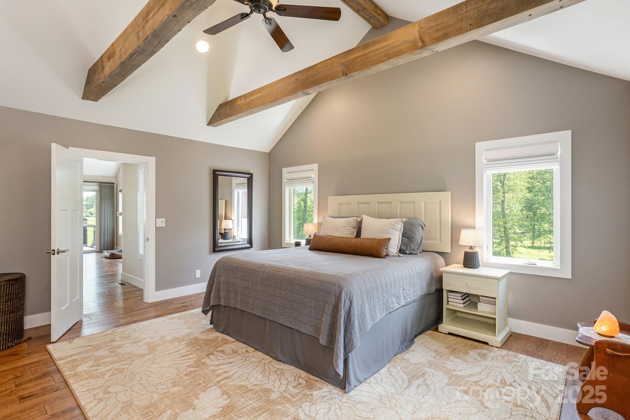 16 School House Road Mills River, NC 28759 - Photo 19 of 48 a bedroom with a bed and a dresser next to a window
