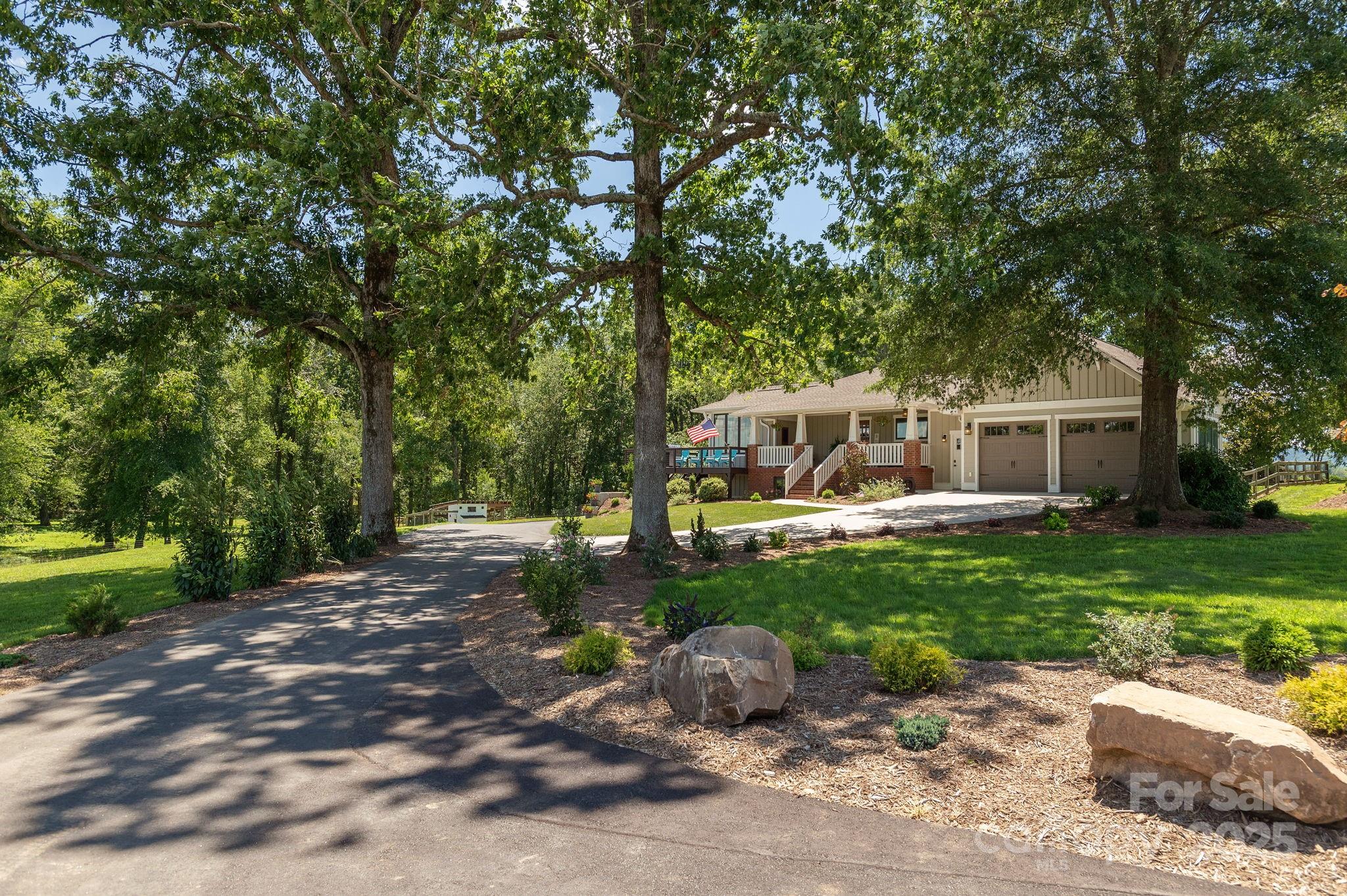 16 School House Road Mills River, NC 28759 - Photo 2 of 48 a front view of a house with garden
