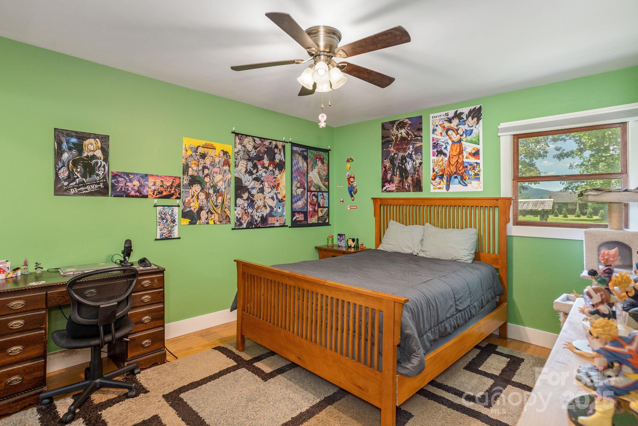 16 School House Road Mills River, NC 28759 - Photo 26 of 48 a bed sitting in a bedroom next to a window and a bookshelf