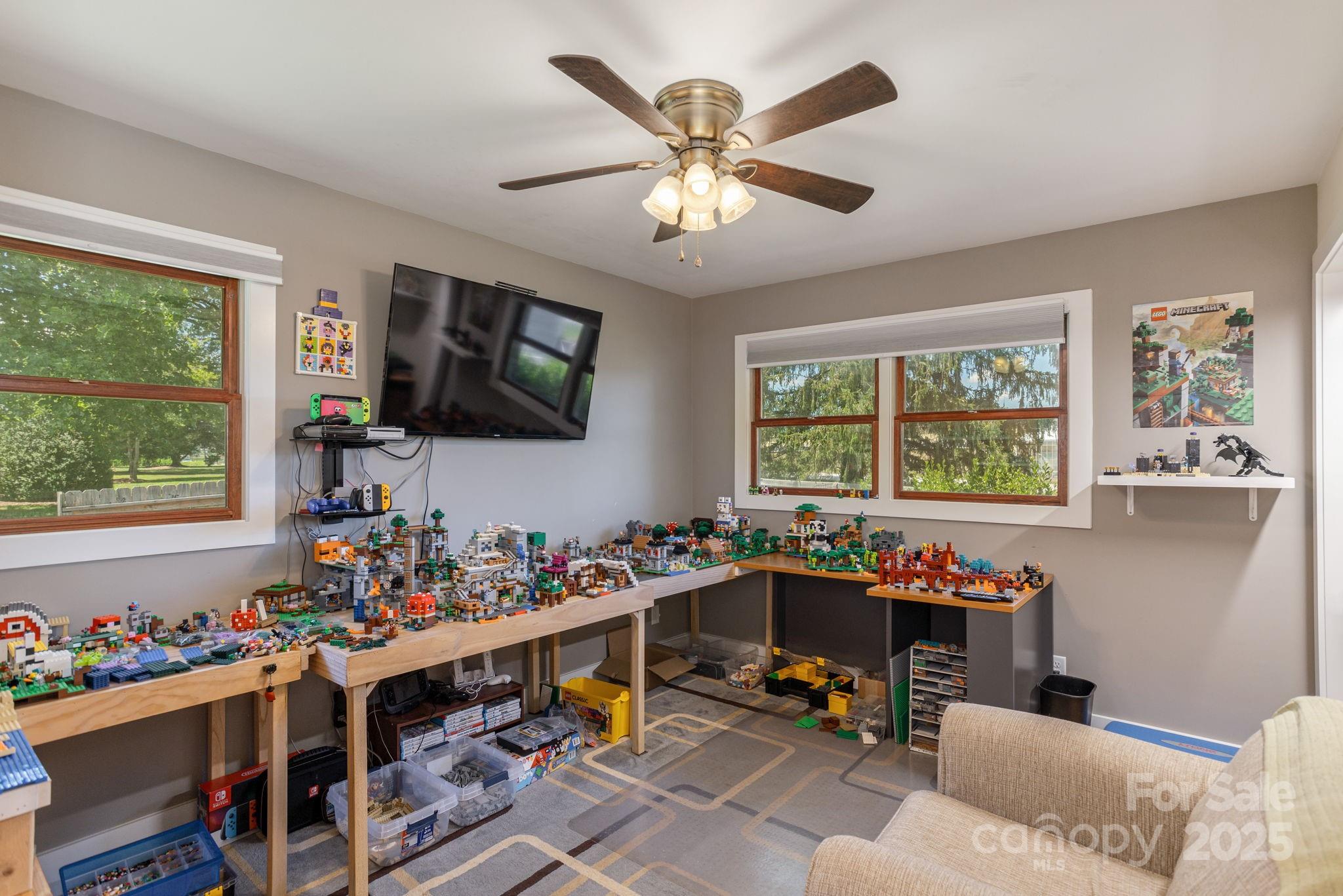 16 School House Road Mills River, NC 28759 - Photo 29 of 48 a room with furniture a flat screen tv and a window