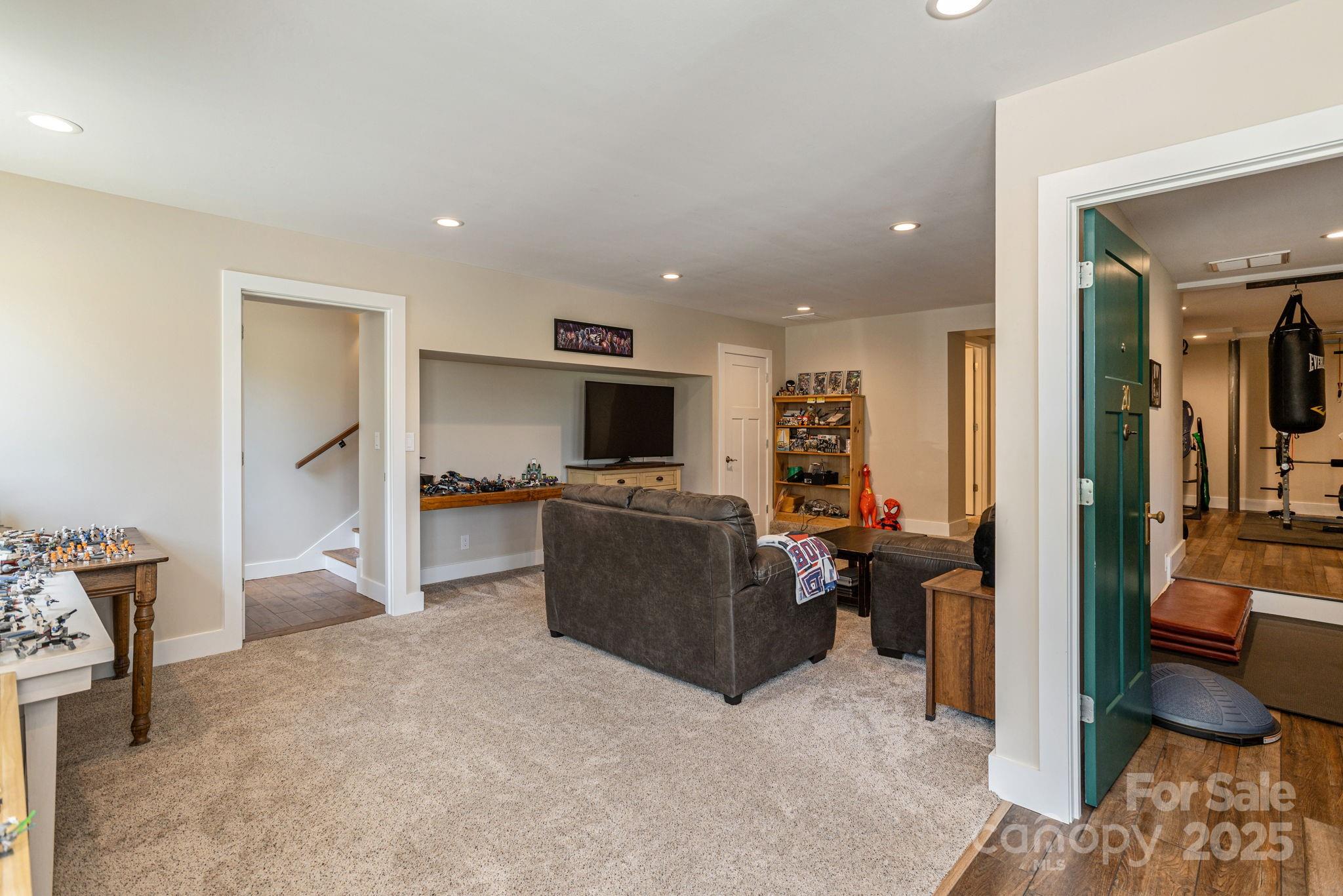 16 School House Road Mills River, NC 28759 - Photo 31 of 48 a living room with furniture and a flat screen tv