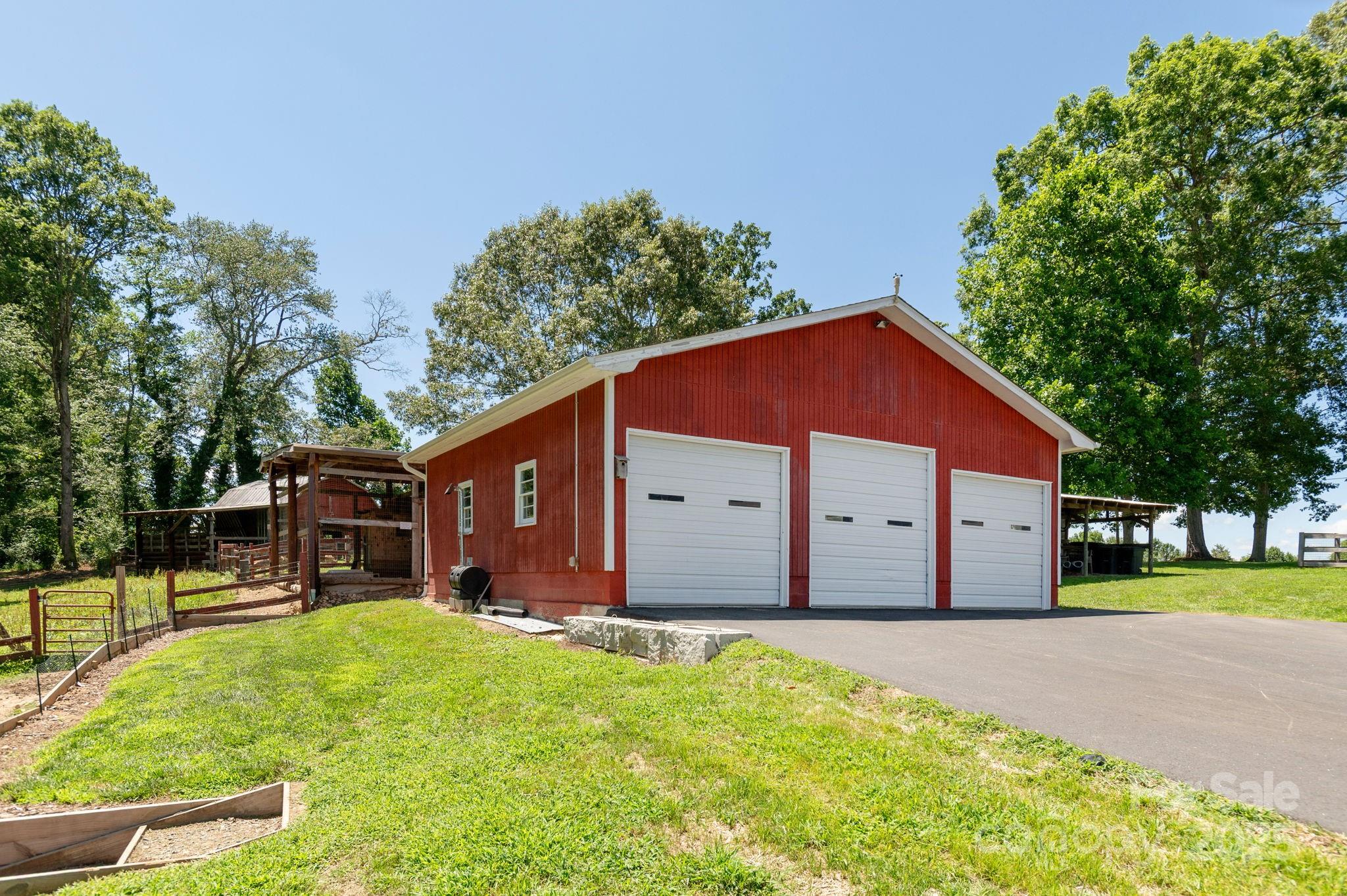 16 School House Road Mills River, NC 28759 - Photo 36 of 48 a view of a house with a yard and large tree