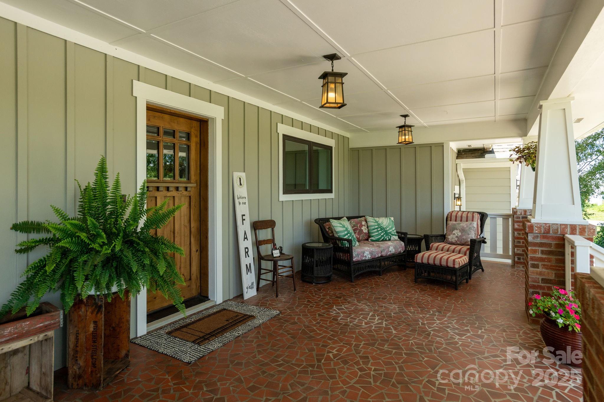 16 School House Road Mills River, NC 28759 - Photo 5 of 48 a living room with furniture and a potted plant