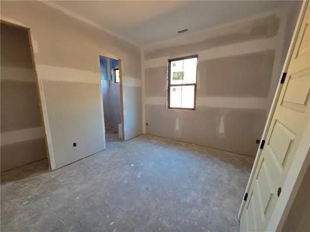 a view of hallway with windows