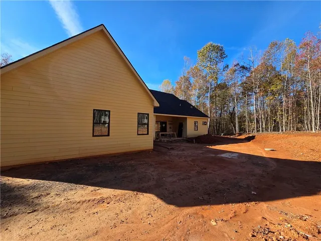 a view of a backyard of the house