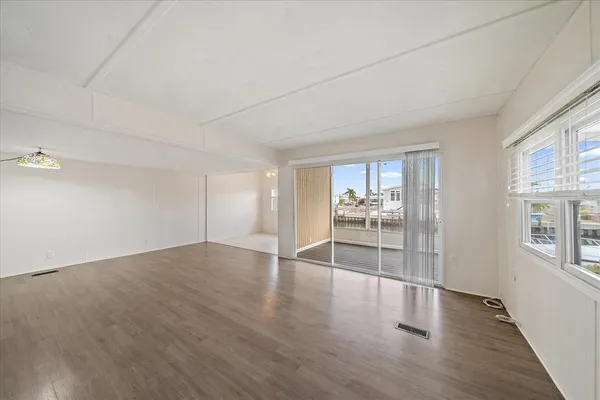 a living room with furniture potted plant and a window