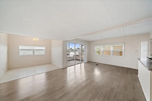 a kitchen with granite countertop cabinets and window