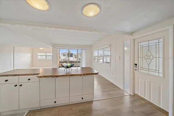 a bathroom with a granite countertop double vanity sink and a mirror