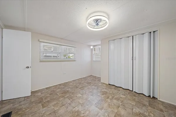an empty room with a view of a bathroom