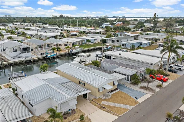 a aerial view of multiple houses with yard