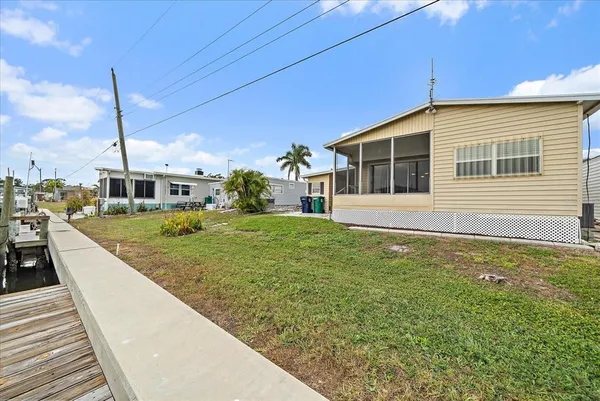 a front view of a house with a yard and porch