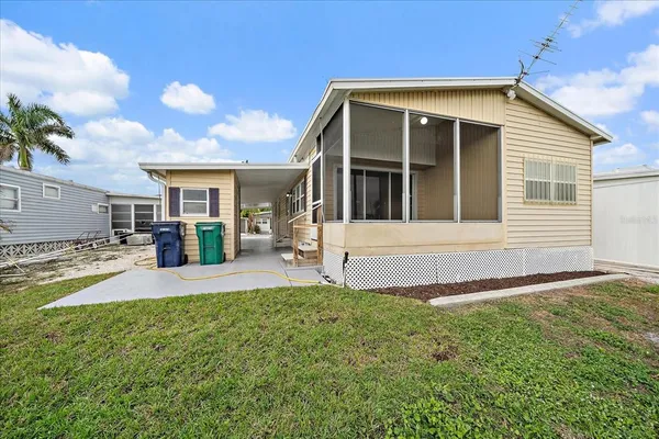 a view of a porch with wooden walls