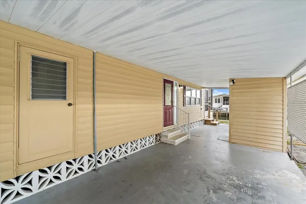 a kitchen with stainless steel appliances kitchen island granite countertop a table and chairs