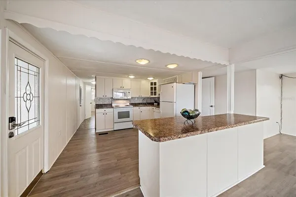 a view of kitchen with wooden floor