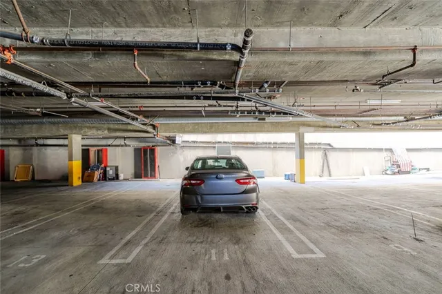 a view of parking garage with cars