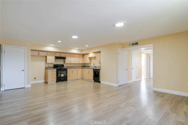a view of kitchen with wooden floor