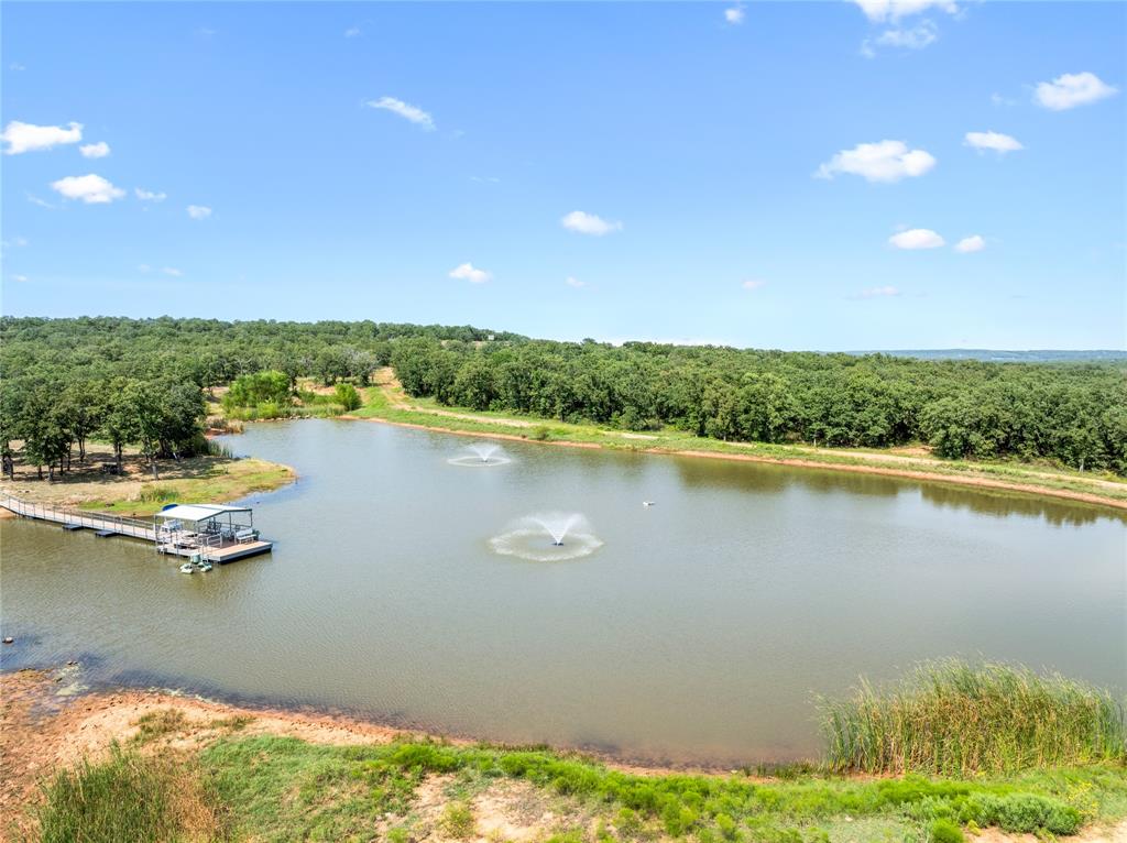 6294 Bugscuffle Road Bowie, TX 76230 - Photo 1 of 1 a view of a lake with houses in the back
