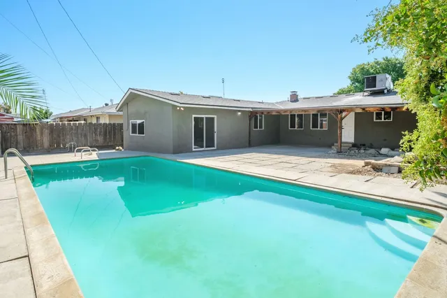 a view of a house with a swimming pool