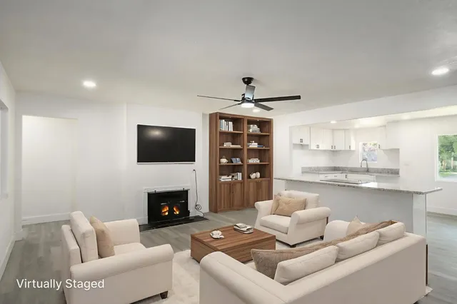 a living room with furniture and a fireplace
