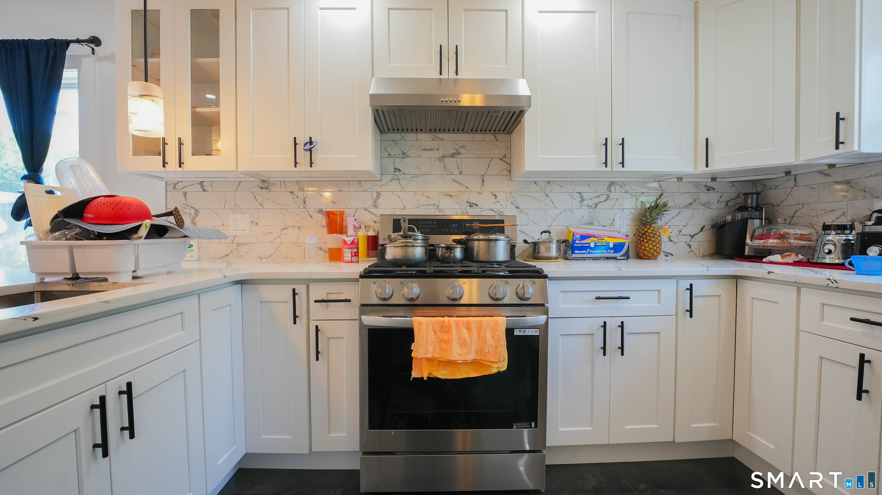 849 Frost Road Waterbury, CT 06705 - Photo 5 of 36 a kitchen with stainless steel appliances granite countertop white cabinets sink and dishwasher
