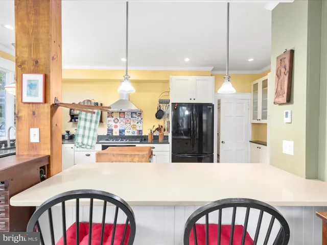 a view of a livingroom with furniture and a flat screen tv