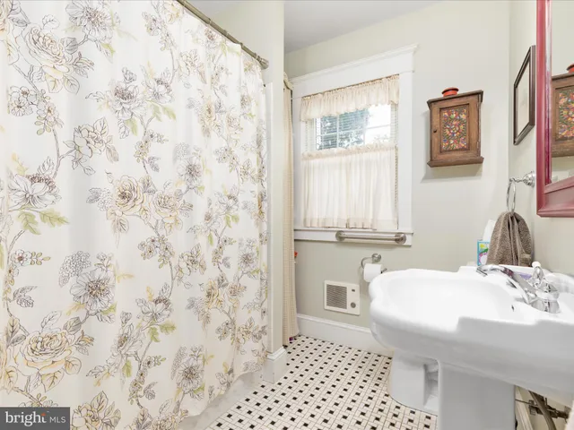 a kitchen with a sink stove top oven and microwave