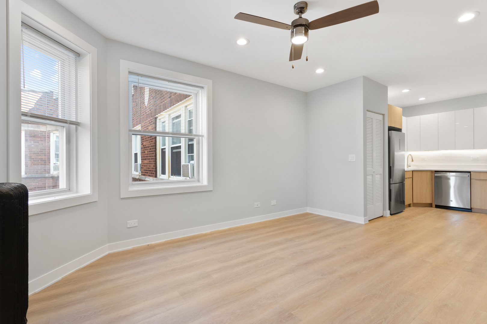 7383 North Damen Avenue, Unit 3E Chicago, IL 60645 - Photo 2 of 14 a view of livingroom with hardwood floor and ceiling fan