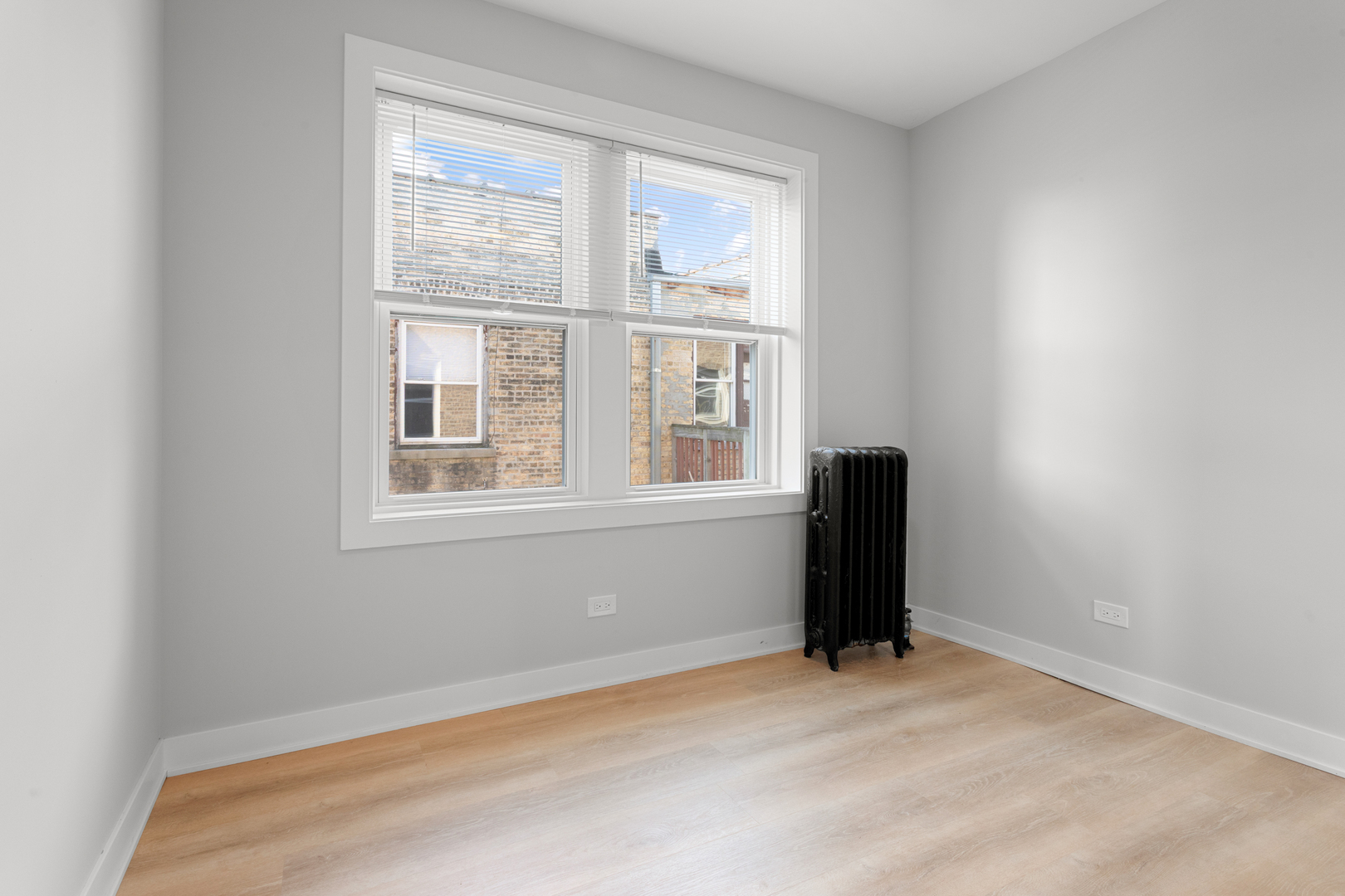7383 North Damen Avenue, Unit 3E Chicago, IL 60645 - Photo 9 of 14 a view of a room with a window
