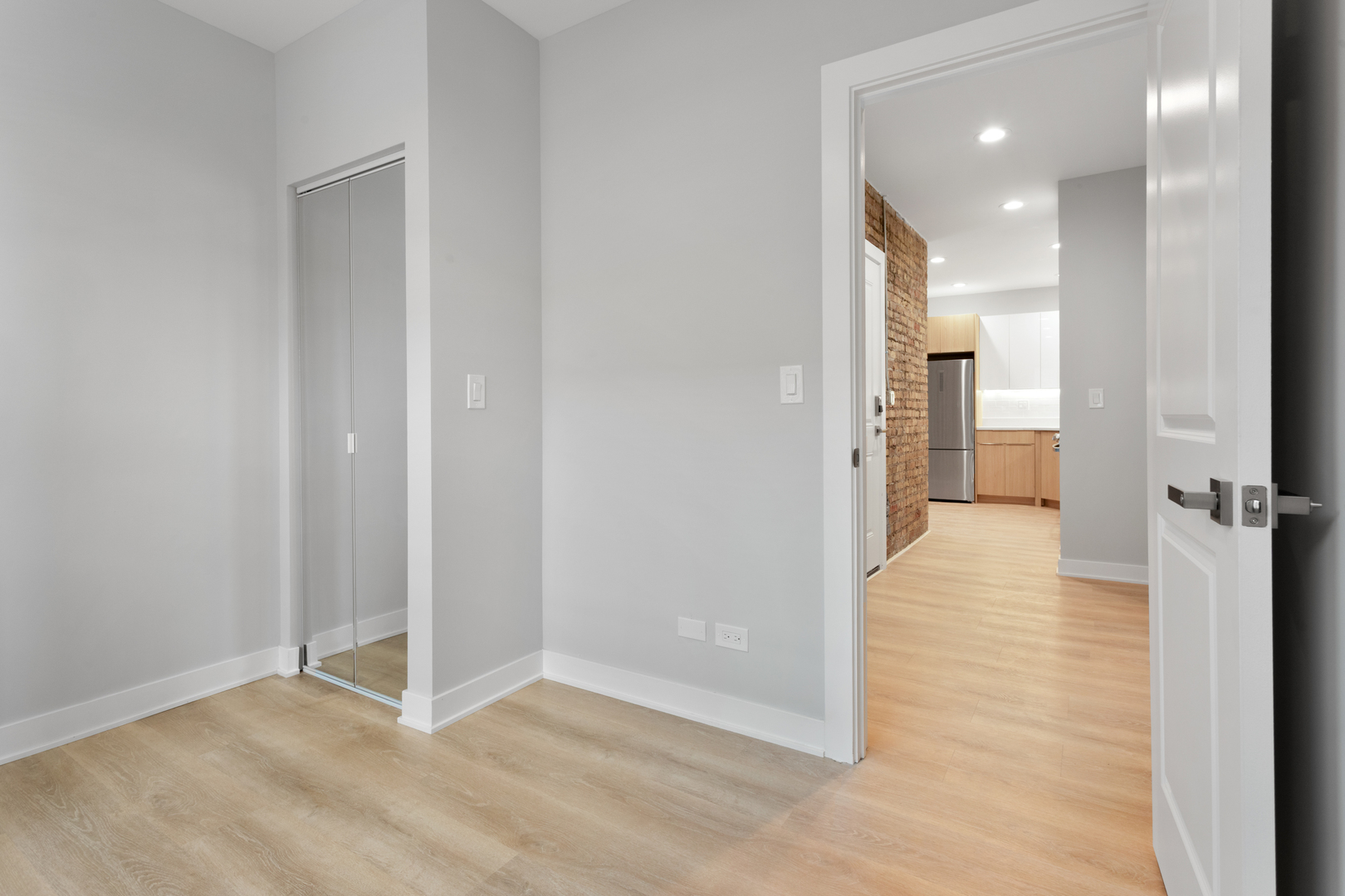 7383 North Damen Avenue, Unit 3E Chicago, IL 60645 - Photo 10 of 14 a view of a hallway with a room