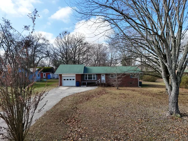 an aerial view of a house with outdoor space