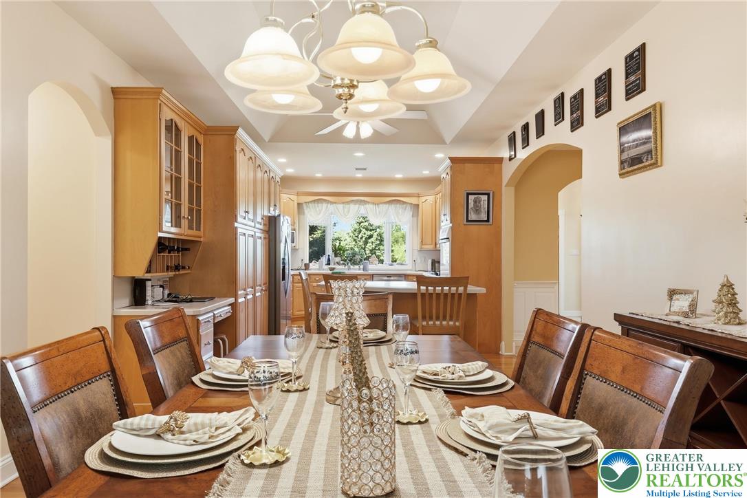 5217 Cider Press Road Schnecksville, PA 18078 - Photo 15 of 54 a view of a dining room with furniture and a chandelier