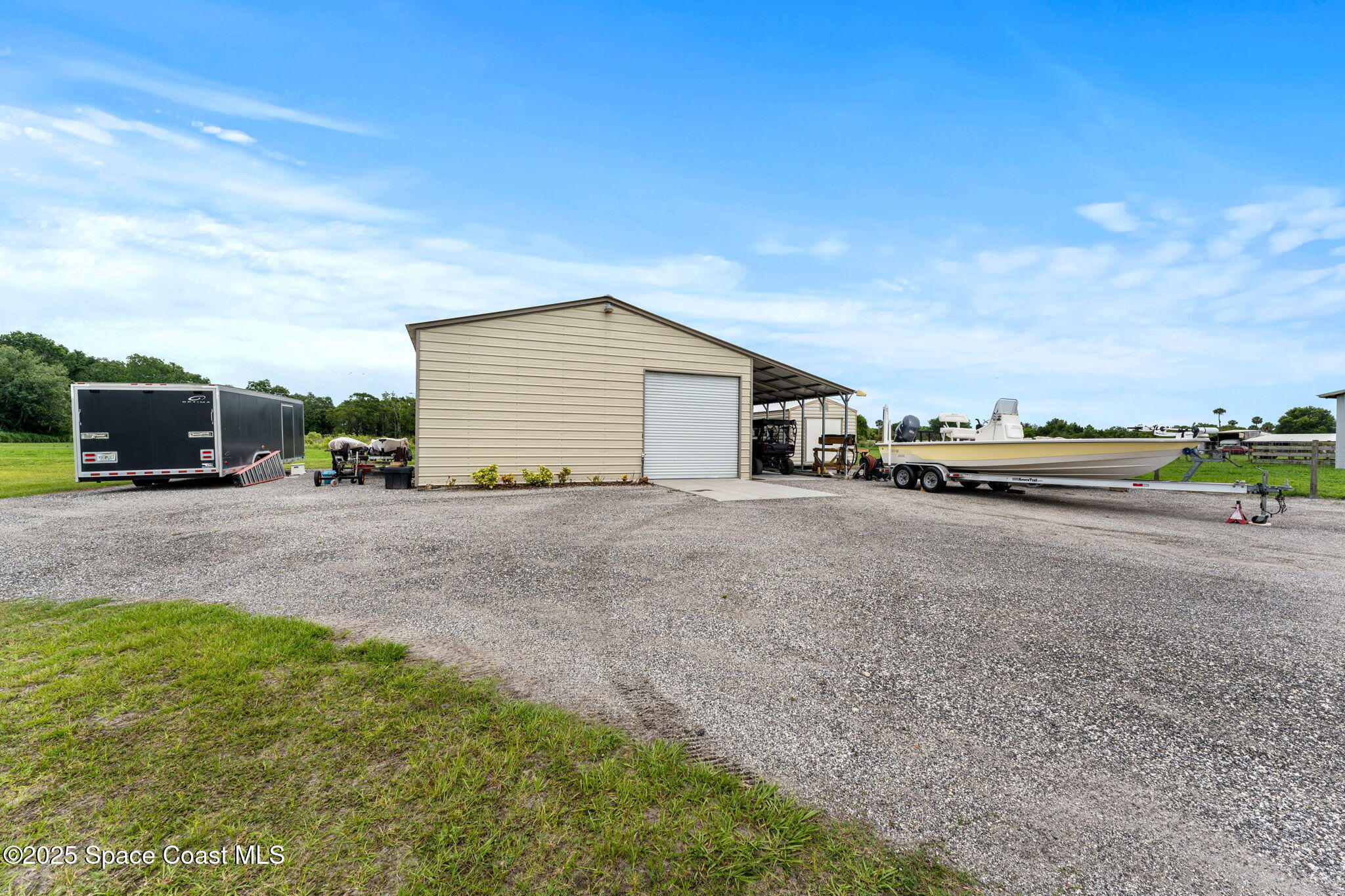 6435 Dixie Way Mims, FL 32754 - Photo 39 of 56 rear detached shop and carport