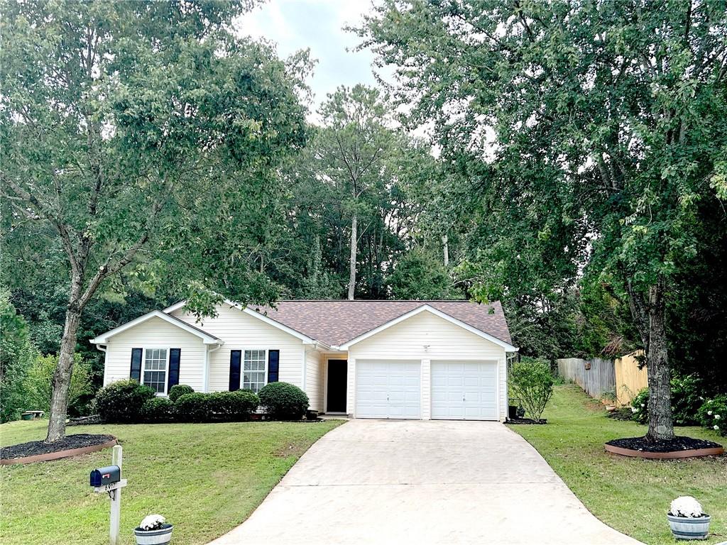 6917 Fields Drive Douglasville, GA 30135 - Photo 1 of 1 a front view of a house with yard