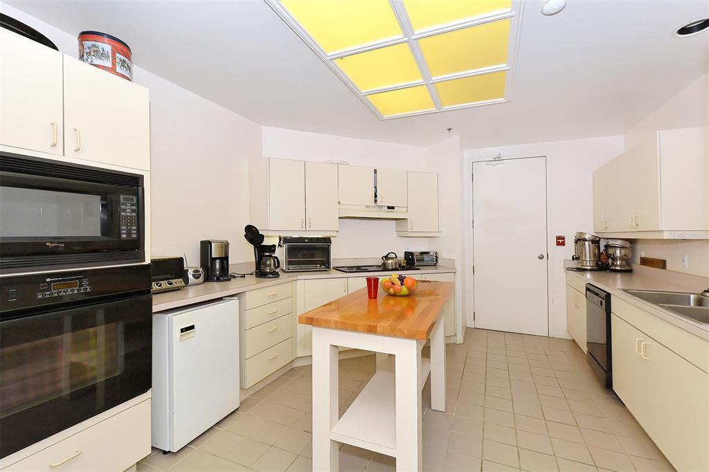 455 Longboat Club Road, Unit 608 Longboat Key, FL 34228 - Photo 44 of 57 Community Room/Kitchen.