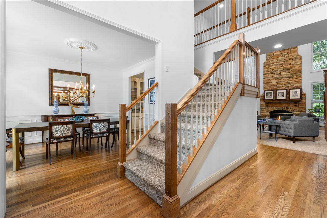 106 Red Maple Way Clemson, SC 29631 - Photo 2 of 49 Gleaming hardwood floors and a classic staircase connect the formal dining and living spaces.
