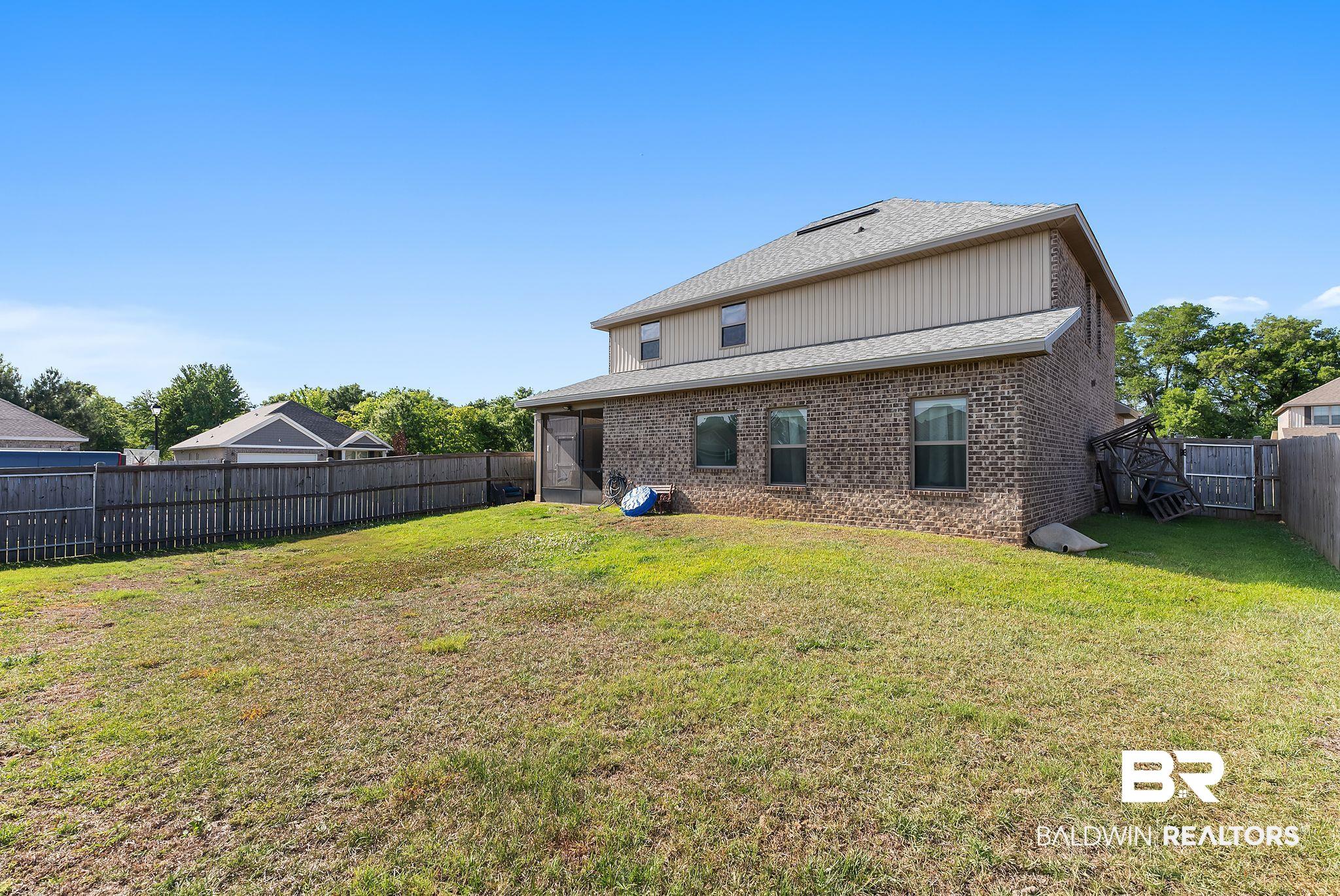 16607 Prado Loop Loxley, AL 36551 - Photo 44 of 46 Spacious backyard with a partial wood privacy fence