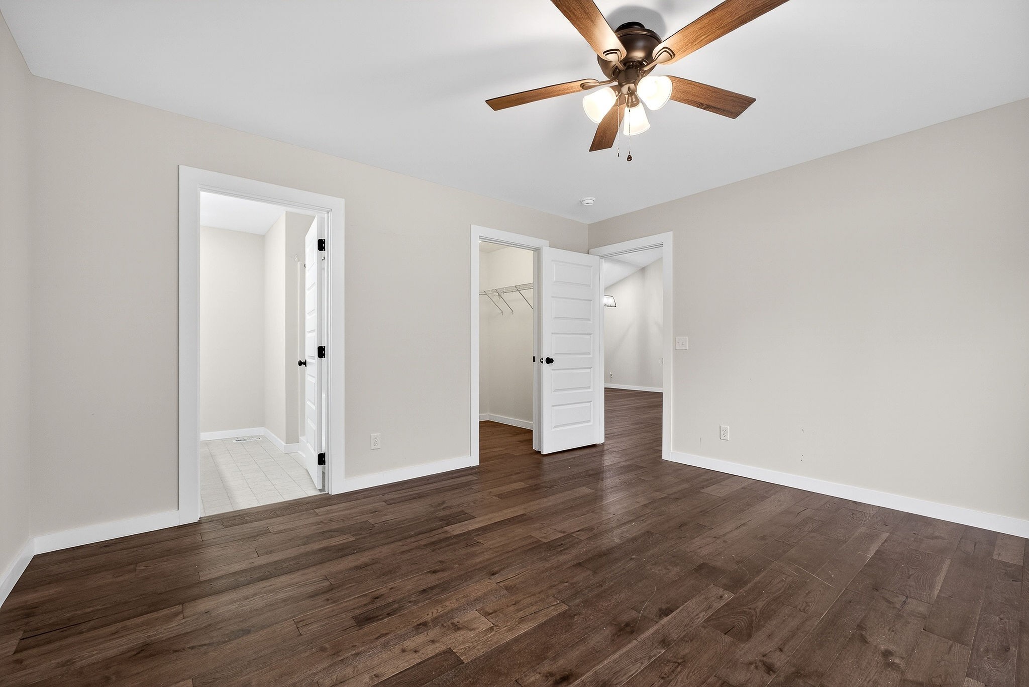 4140 Eller Ridge Road Cookeville, TN 38506 - Photo 26 of 33 an empty room with wooden floor ceiling fan and window