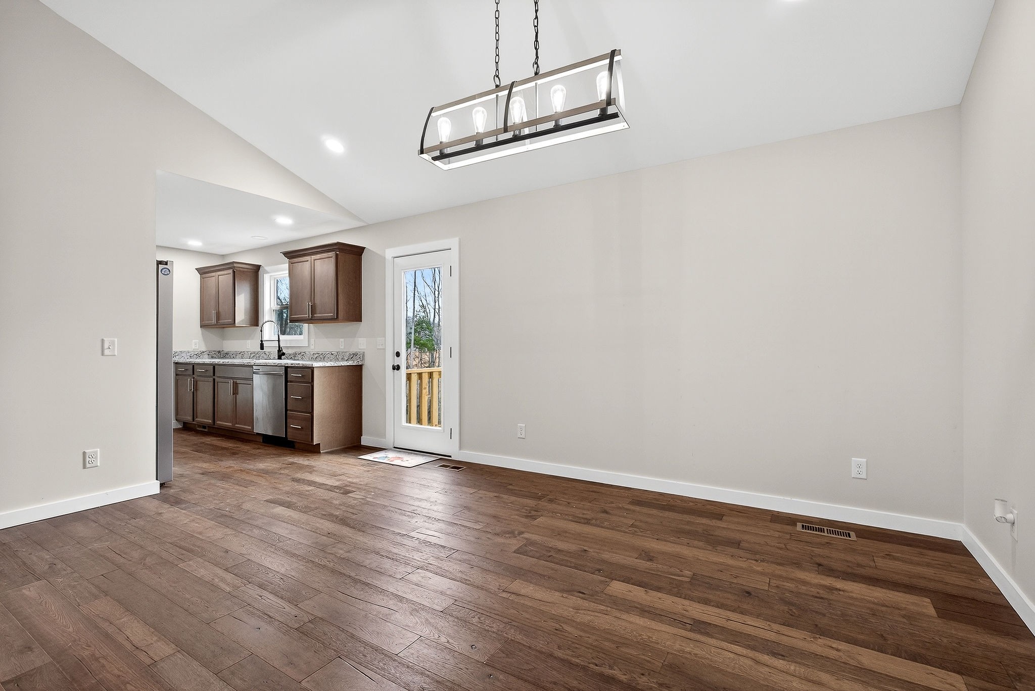 4140 Eller Ridge Road Cookeville, TN 38506 - Photo 10 of 33 a view of a kitchen with a sink stove cabinets and empty room