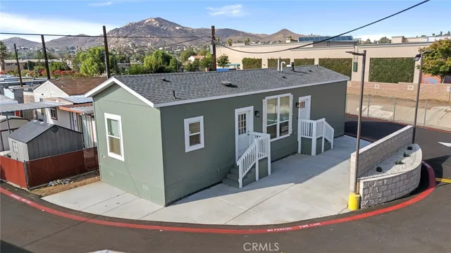 a view of a house with a sink and yard