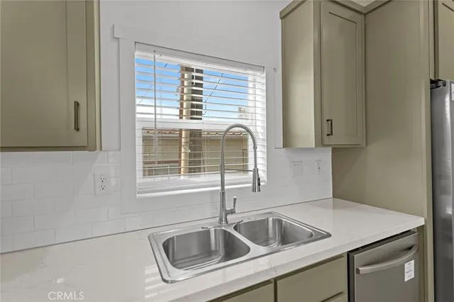 a kitchen that has a sink and a window