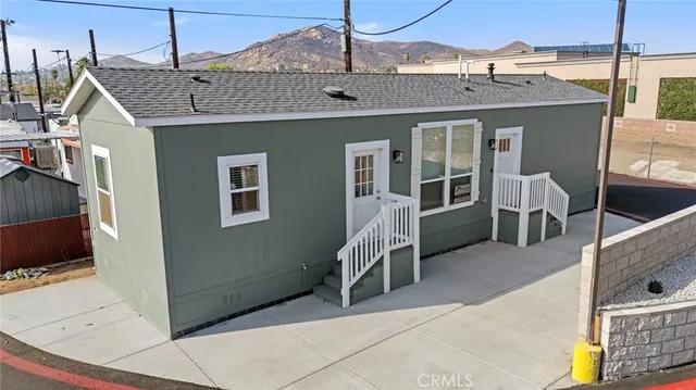 a front view of a house with glass windows