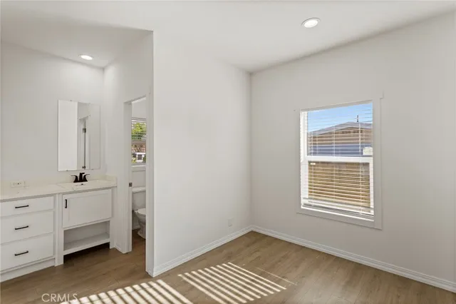 a view of room with window and cabinet