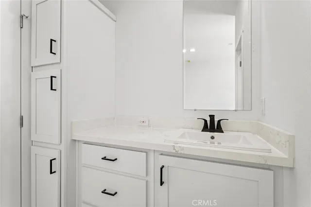 a view of a terrace with couches and wooden fence