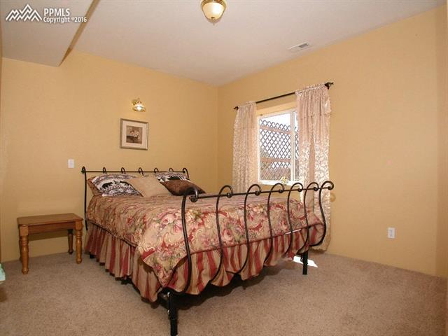 12153 Rio Secco Road Peyton, CO 80831 - Photo 17 of 26 Lower level bedroom #4